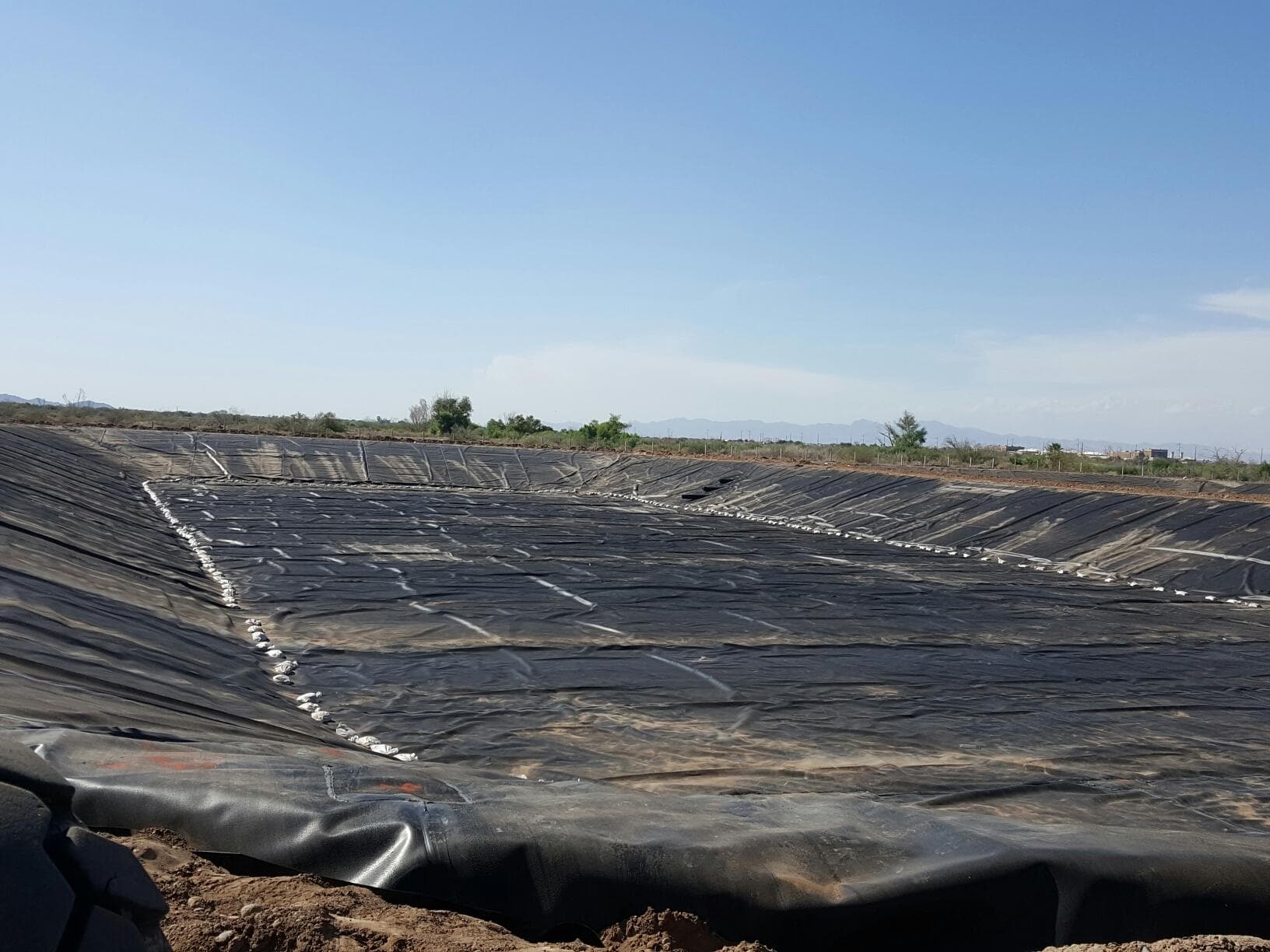 Lagoon Liner Materials Compared: HDPE, LLDPE, RPP, and XR-5 in Exposed Service